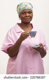 Black Maid Holding A Cup Of Tea