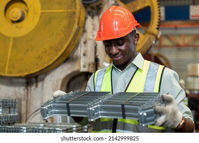 Black Male African American Workers Wear Red Helmet Working Check Up Iron Production In Factory. Heavy Industrial Manufacturing Workplace.