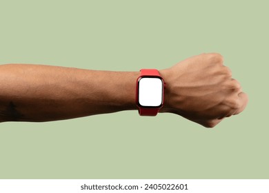 black male arm wearing red smartwatch with blank screen isolated on light green - Powered by Shutterstock