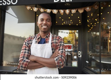 Black Male Business Owner Standing Outside Coffee Shop