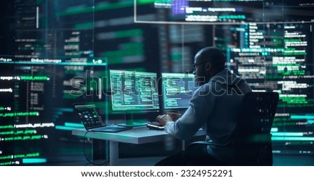 Black Male Developer Typing on Computer, Surrounded by Transparent Screens Showing Code Prompts. Professional Programmer Creating Complex Software, Running Coding Tests. Futuristic Programming.