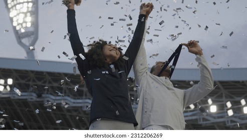 Black Male and Female Athletes Celebrate a Win on a podium after receiving gold medal - Powered by Shutterstock