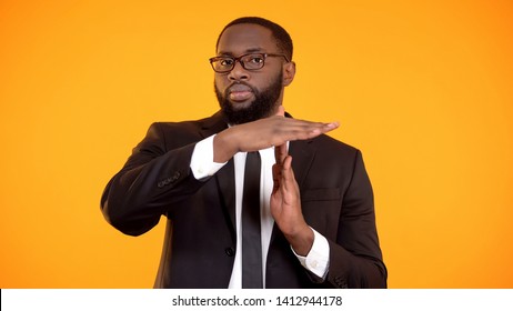 Black Male In Formalwear Showing Time Out Sign, Interrupt Negotiations, Vacation