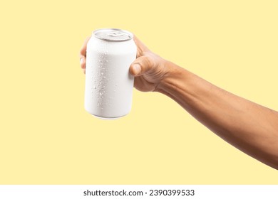 Black male hand holding a fresh white drinking can mockup of beer or soda
