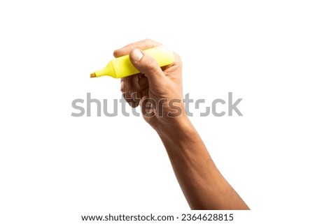 Black male hand holding a yellow marker pen, Highlighter isolated no background