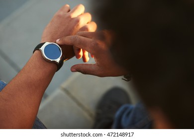 Black Male hand with Smart Watch on wrist. Smartwatch empty screen