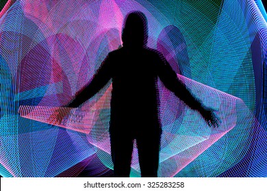 Black Male Siluette On Color Background With Light Painting Or Light Drawing 