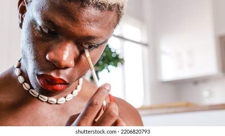 Black Man Applying Makeup At Home