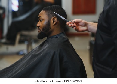 Black Man In The Barbershop. Cute Black Man Makes A Haircut In The African Salon. Hair Style. Haircut For Adults.