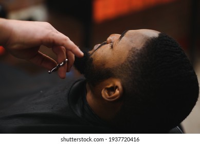 Black Man In The Barbershop. Cute Black Man Makes A Haircut In The African Salon. Hair Style. Haircut For Adults.