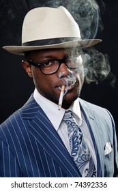 Black Man With Blue Striped Suit And Blue Hat Singing In A Smoky Nightclub Like A Cotton Club