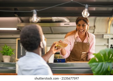 Black man buying fast food in truck - Powered by Shutterstock