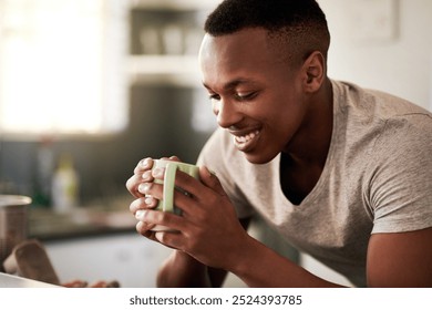 Black man, coffee and thinking in home, reflection and hot beverage for peace in kitchen. Male person, contemplating future and mug of espresso for recovery, ponder ideas and perspective on memory - Powered by Shutterstock