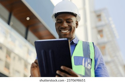 Black man in construction, tablet and architect working on floor plan, inspection and maintenance job outdoor. Check digital blueprint for architecture project, design software and quality assurance - Powered by Shutterstock