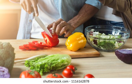 Black Man Cutting Vegetables For Healthy Vegetarian Salad In Kitchen, Closeup