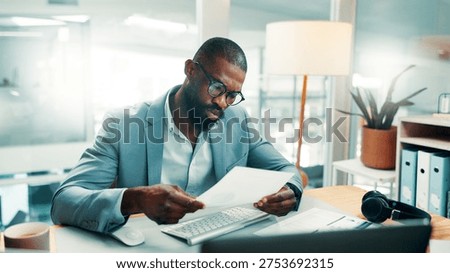 Black man, documents and report with computer at office with glasses, review or perspective at investment company. African person, broker and insight with notes, admin and budget at finance agency