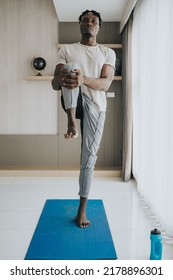 Black Man Doing Leg Stretching Exercise At Home. Workout At Home 