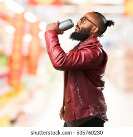 Black Man Drinking A Beer