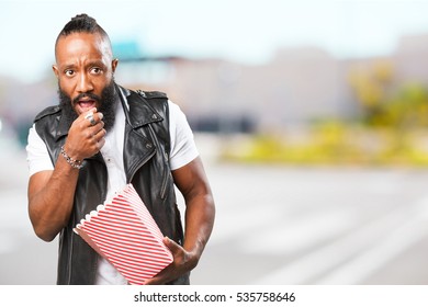 Black Man Eating Popcorn