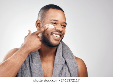 Black man, face cream and smile in studio for beauty with application, cosmetics and pride by mockup. Male model, hand and skincare treatment with lotion, moisturizer and results by white background - Powered by Shutterstock