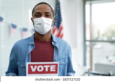 Black Man In Face Mask With Voting Card