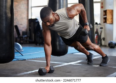 Black man, fitness and muscle training with dumbbells in gym, exercise with balance and strong athlete, push up and focus. Sports, bodybuilder power and wellness with health and active lifestyle - Shutterstock ID 2246071777