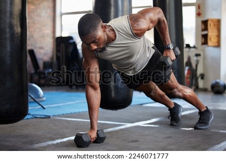 Black man, fitness and muscle training with dumbbells in gym, exercise with balance and strong athlete, push up and focus. Sports, bodybuilder power and wellness with health and active lifestyle