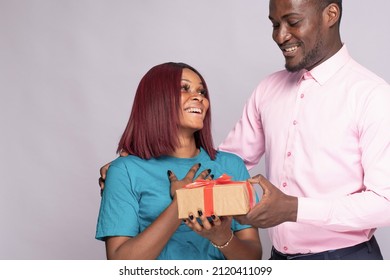 black man gives his girlfriend a gift