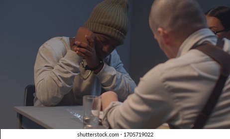 Black Man Handcuffed At Police Interrogation. Sliding