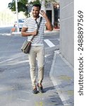 Black man, headphones and outdoor for street commute, walking and listening to music in city. Male person, student and streaming sound or audio on journey to college, travel and podcast in urban town