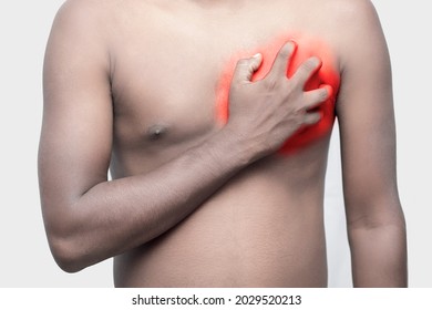 A Black Man Holding His Chest By Hand For Chest Pain.