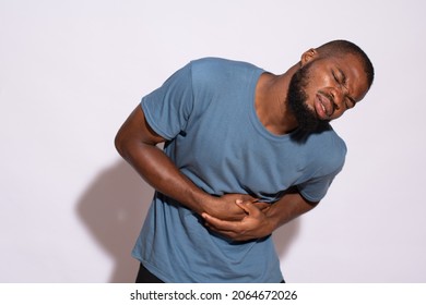 Black Man Holding His Stomach And Feeling Discomfort