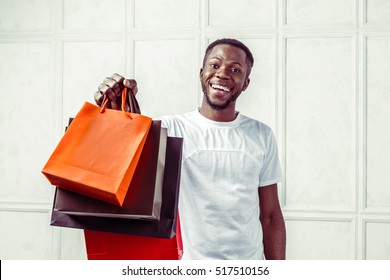  Black Man Holding Shopping Bags 