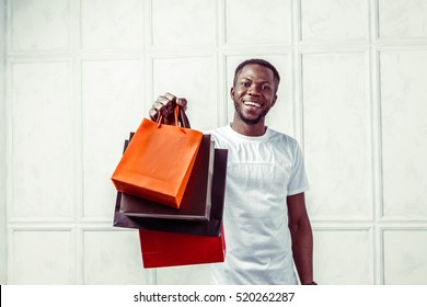  Black Man Holding Shopping Bags 