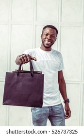  Black Man Holding Shopping Bags 