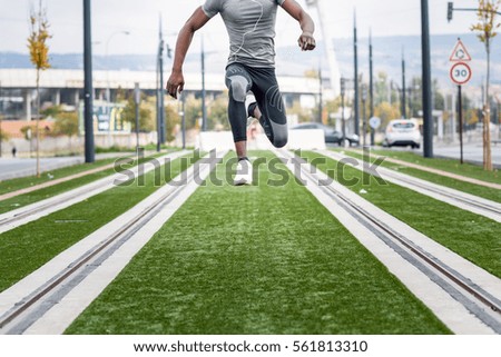 Similar – Black man practicing yoga in urban background.