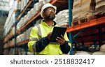 Black man, logistics and tablet at warehouse for distribution industry, stock checklist and package inventory. Worker, thinking and digital with inspection for shipping order, supply chain and safety