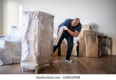 Black Man Moving Furniture