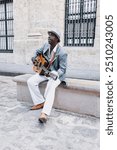 Black Man musician playing guitar on the street in La Havana Cuba in Latin America Caribbean city