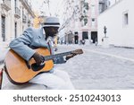 Black Man musician playing guitar on the street in La Havana Cuba in Latin America Caribbean city