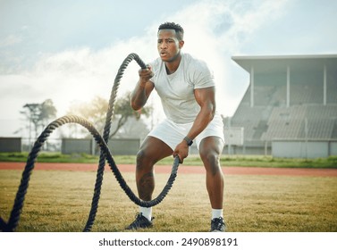 Black man, outdoor and gym with battle ropes, field and fitness for resistance training or exercise. Male person, cardio and routine for bodybuilding, strong muscle and endurance for power or workout - Powered by Shutterstock