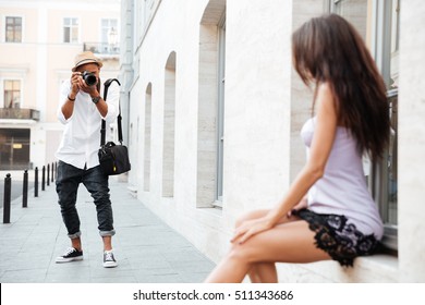 Black man photographed pretty model on the street - Powered by Shutterstock