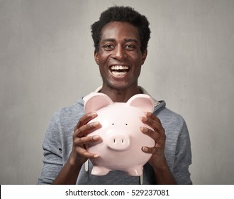 Black Man With Piggy Bank.