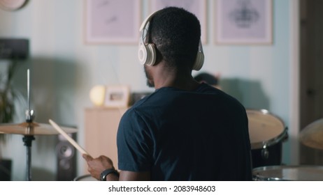 Black Man Playing Drums At Home