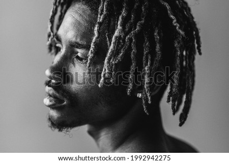 Black man posing in a studio