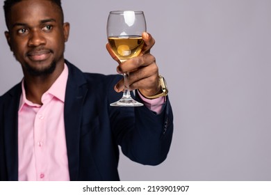 Black Man Raising A Glass Of Wine Close Up