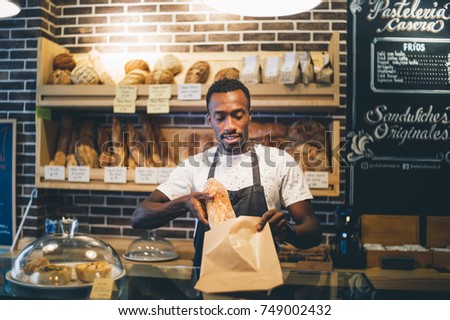 Similar – Image, Stock Photo African man works in pastry shop.