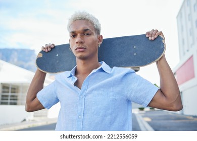 Black man, serious with a skateboard and city, urban background and trendy, hipster fashion in portrait. Young African American hobbies, skater and gen z youth outdoors at skatepark during summer. - Powered by Shutterstock