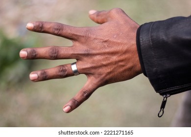 A Black Man Showing Five Fingers Of His Hand