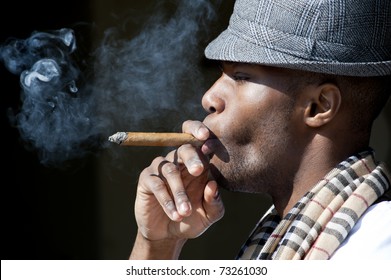 Black Man Smoking Cigar Portrait With Hat.